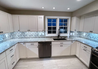 kitchen remodel featuring koch cabinets in white paint shaker door slab drawer front